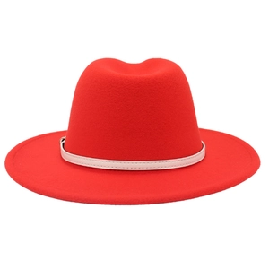 Detail of red wool felt fedora featuring a slim cream leather belt and metallic buckle