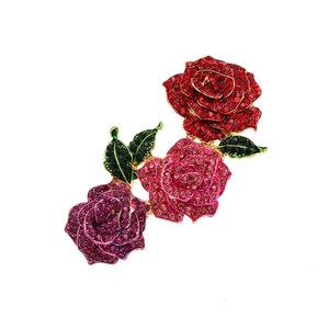 Luxury rose flower brooch with colorful crystals and green leaves on gold alloy base