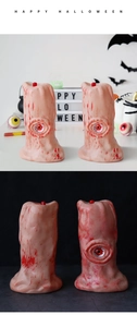 Macro shot of Halloween bloodshot eyeball candle with realistic red vein texture