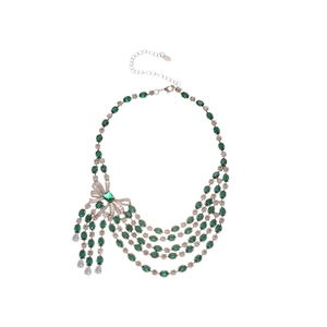Luxurious multi-layer necklace with green oval gemstones and a sparkling zircon bow pendant