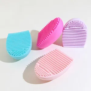Silicone makeup brush cleaner eggs in four colors with various textured surfaces