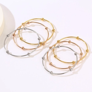 Minimalist stainless steel wire bangle set with sliding beads in gold, silver and rose gold