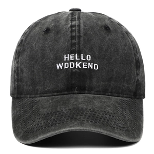 Unisex washed black cotton baseball cap with HELLO WEEKEND embroidery on white background