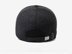 Detail view of the thick textured fabric and adjustable metal buckle on the baseball cap