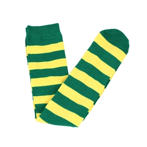 Detail of green and yellow striped knit knee-high socks with high-contrast ribbed texture
