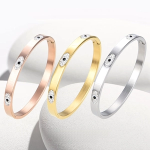 Evil eye bangle bracelets set in rose gold, gold and silver finishes with white crystals