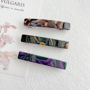 Three-piece acetate marble spring hair clips set in brown blue and green patterns