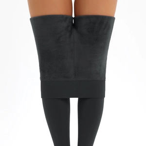 Detail of high-waisted warm leggings showing thick black fleece lining for winter wear