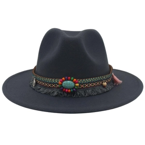 Close-up of ethnic beaded band with turquoise on a dark gray wool felt cowboy hat
