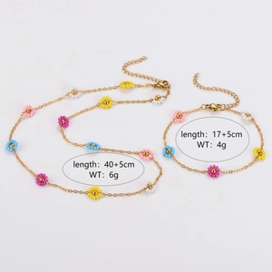 Floral necklace and bracelet jewelry set with colorful beads on gold-tone chains