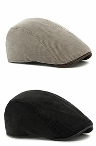 Detailed corduroy texture of black and grey flat caps with vintage brown brim piping