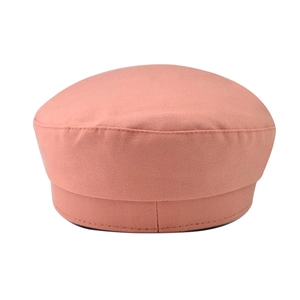 Detail of coral pink beret featuring premium twill cotton fabric and precise edge stitching