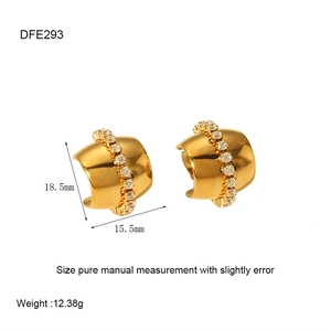 Detailed close-up of C-shaped 18K gold plated earrings with vertical diamond inlay