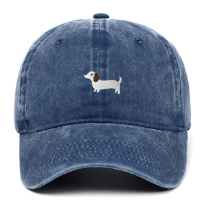 Close-up of dachshund embroidery on a navy washed cotton vintage baseball cap