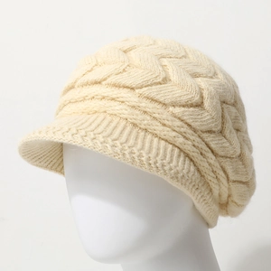 Minimalist cream knit winter beanie with textured cable pattern and short brim for women
