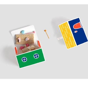 Detail view of cute house-shaped gift boxes with creative color-block designs