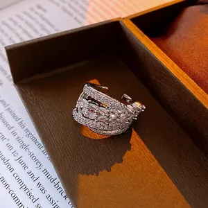 Luxurious silver open ring with multi-layer marquise zircon crystals on a jewelry box