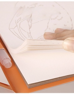 Close-up of thick cold-pressed watercolor paper texture and sturdy album sheets