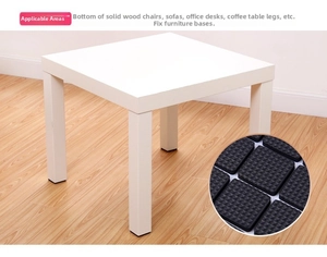 Close-up of black EVA rubber furniture pads with anti-slip texture for table legs