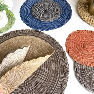 Handwoven round cotton linen placemats in multiple colors with braided texture