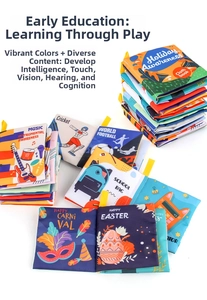 Close-up of soft cloth books with colorful patterns and yellow hanging clips for infants