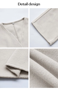 Détail macro du col en V et de la texture polaire douce sur un blazer beige élégant