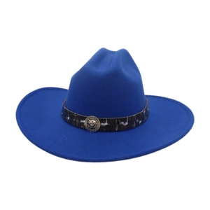 Detail of royal blue felt cowboy hat featuring silver lion head emblem and ethnic hatband
