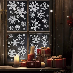 Silver glitter snowflake window clings set on dark glass with Christmas decor