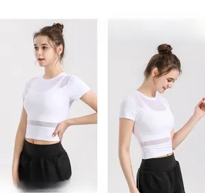 Detail of white crop top featuring breathable mesh panels for fitness and yoga activities