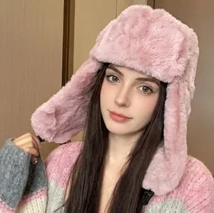 Pink plush trapper hat with ear flaps for winter warmth, stylish faux fur pilot cap for women