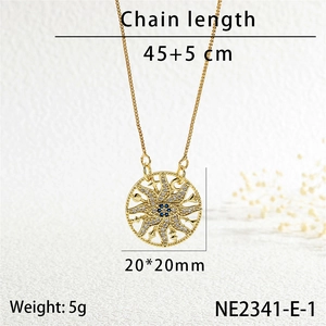 Macro view of gold sun pendant necklace with blue crystal and dimensions of 20x20mm