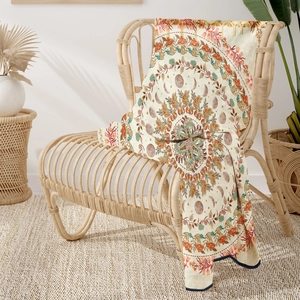 Detail of vintage mushroom and moon phase woven tapestry throw with fringe edges