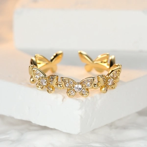 Minimalist adjustable gold ring with pavé butterfly charms and cubic zirconia stones