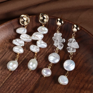 French vintage baroque freshwater pearl drop earrings with raw crystal on wooden tray