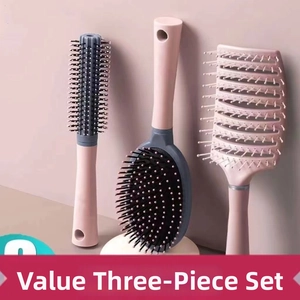 Three-piece hair brush set with paddle, round, and vented curved brushes in pink and grey