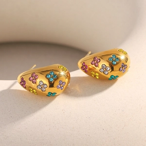 Detailed close-up of 18K gold-plated flower earrings featuring colorful crystal petals