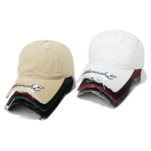 Retro distressed baseball caps with Blannche embroidery and ripped brim details