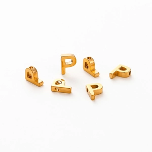 Detailed view of six gold-plated letter P beads for DIY jewelry making on white background