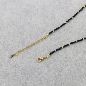 Black crystal beaded necklace with gold heart pendant and stainless steel clasp