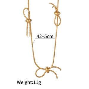 Detail of gold snake chain necklace with bow knots, 42+5cm length and 11g weight info
