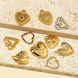 Hollow heart pendants with cubic zirconia inlay on natural sandstone textured steps