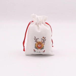 Sac cadeau de Noël en lin blanc avec motif renne et cordon rouge pour les bonbons