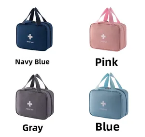 Detailed view of portable first aid kits in navy, pink, grey and blue with top handles