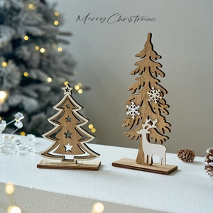 Handcrafted wooden Christmas tree table ornaments with snowflake and deer cutout designs