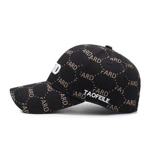 Black baseball cap with all-over letter print and white 3D embroidery detail