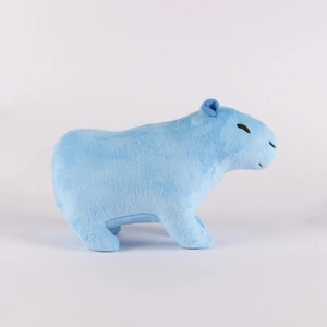 Side view of a blue capybara plush toy with soft texture on a clean grey background