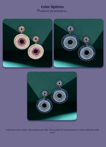Close-up of bohemian hoop earrings with colorful gradient zircon inlay in three colors