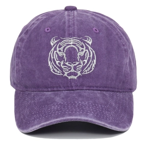 Close-up of silver tiger head embroidery on vintage washed cotton baseball cap