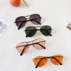 Detail of four colorful aviator sunglasses for kids with durable metal frames and UV protection