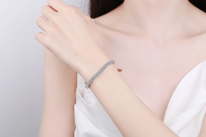 Close-up of 925 sterling silver tennis bracelet with cubic zirconia on a wrist
